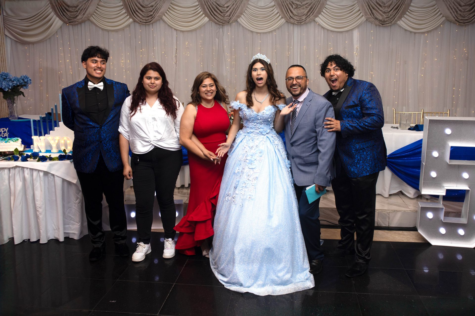 Quinceañera girl in blue ball gown at park gazebo, DFW quinceañera photographer